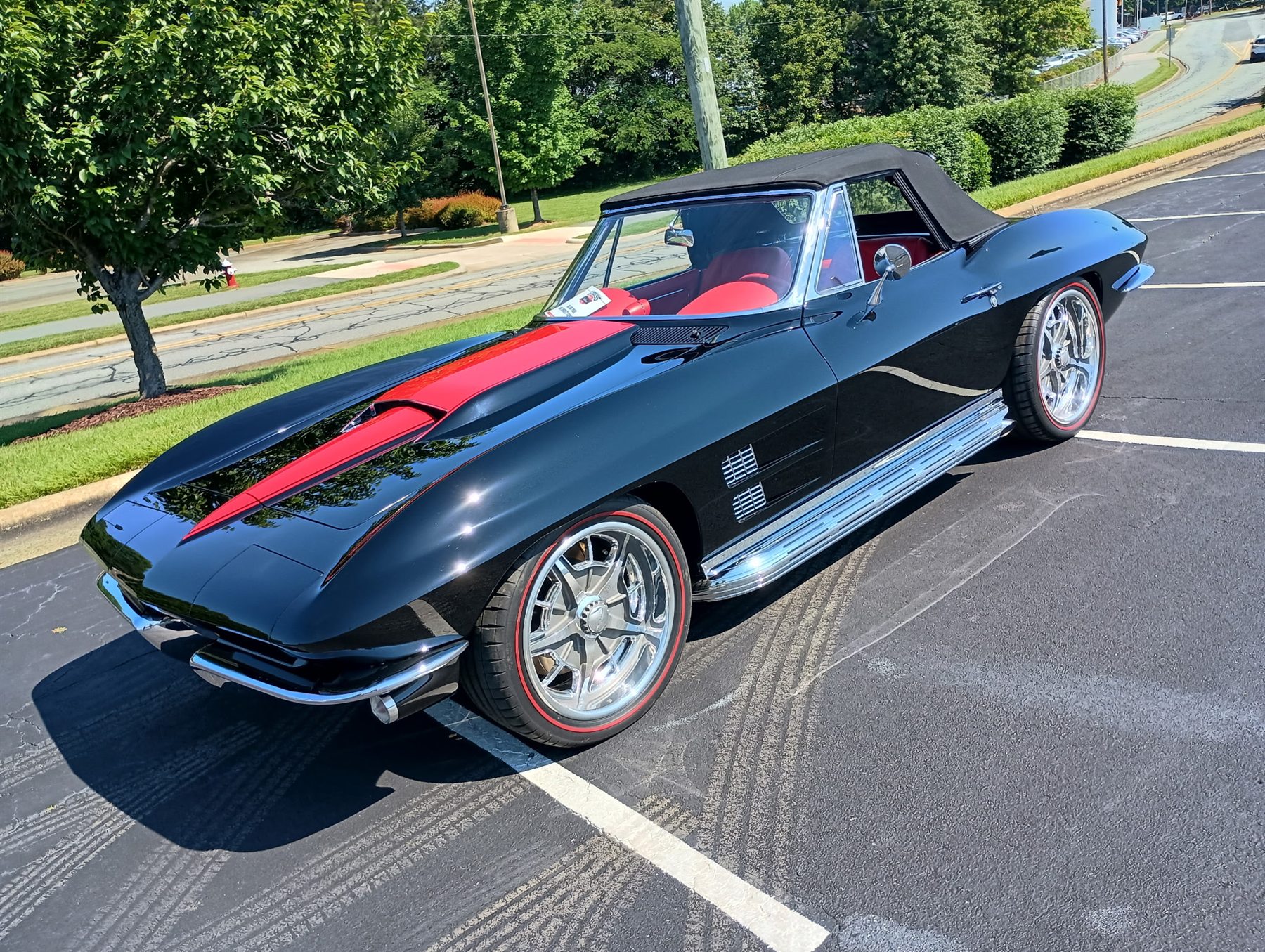 Black classic convertible shown from the front passenger side