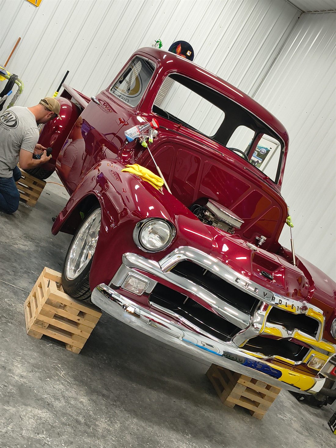 Red classic truck inside the shop